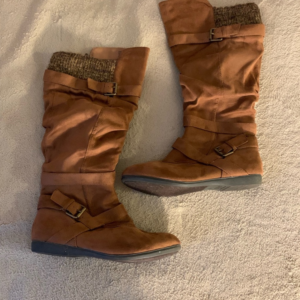 Tan brown knee-high boots.